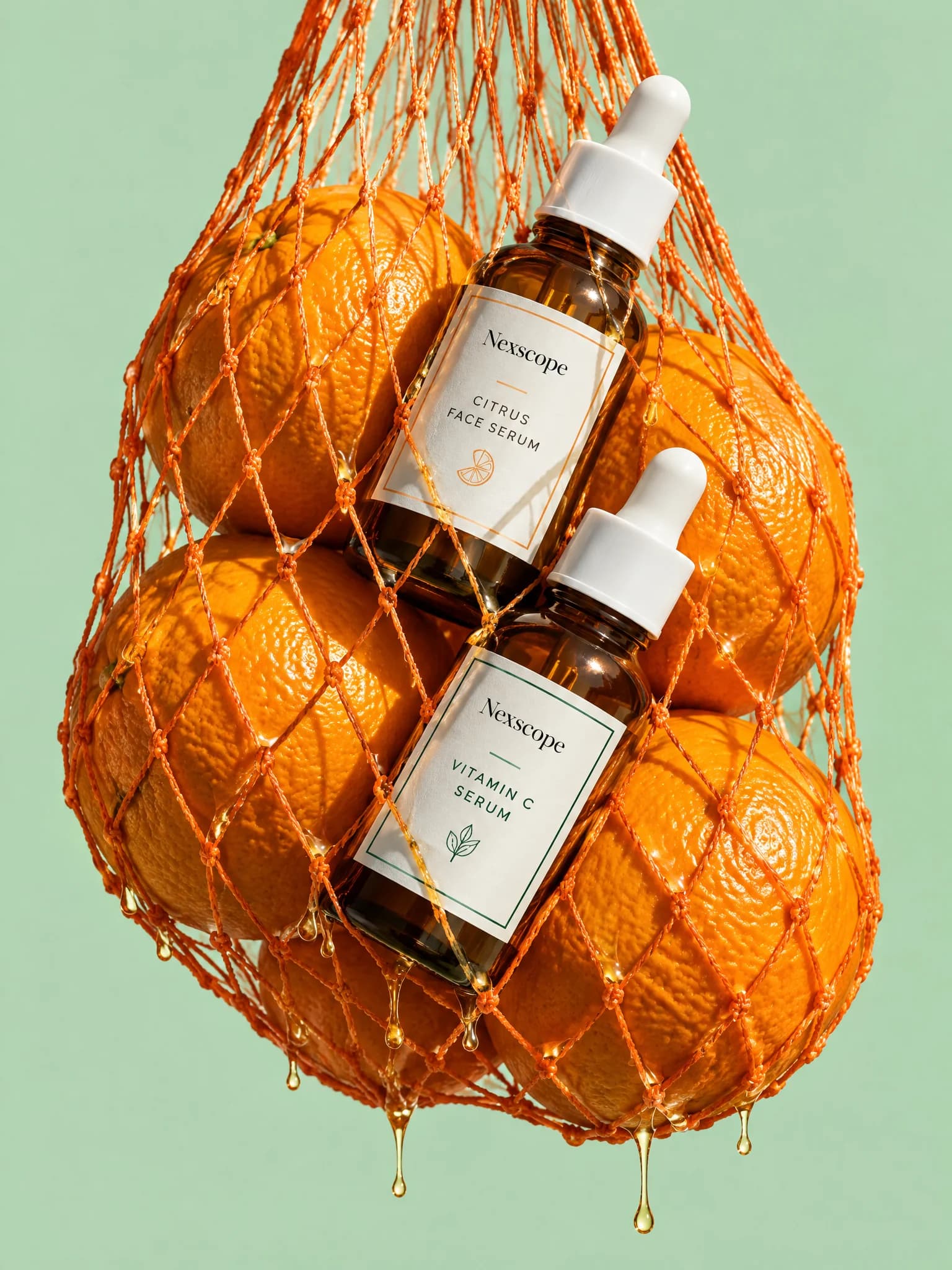 Nexscope serums with oranges in an orange net bag