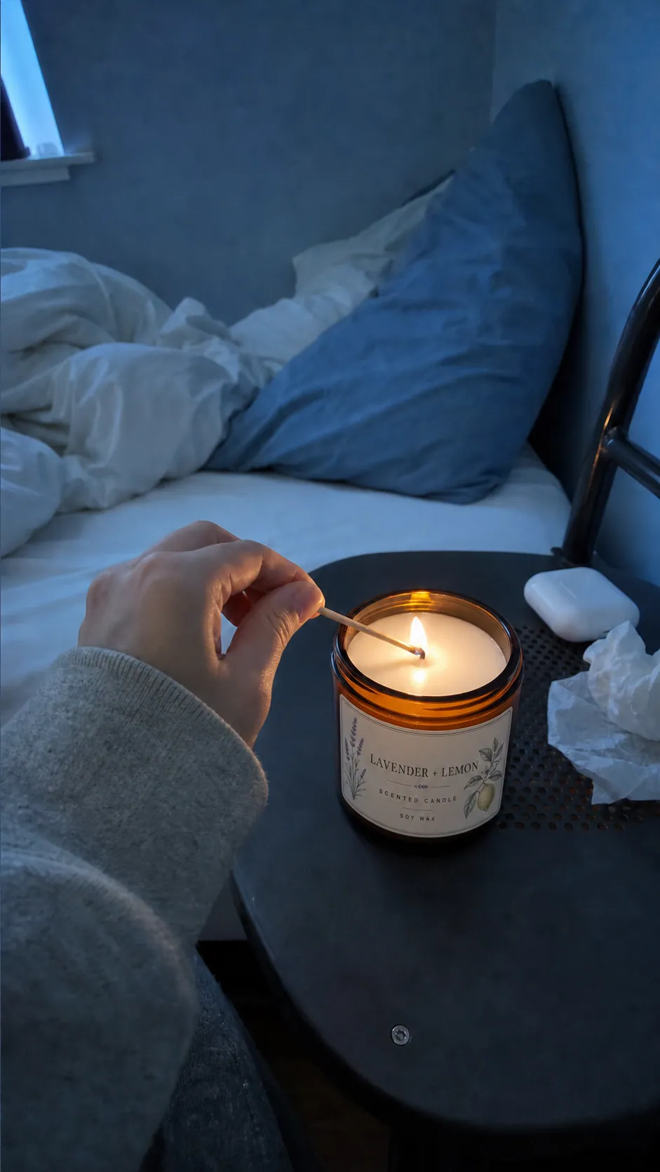 Creator lighting the candle beside a bed