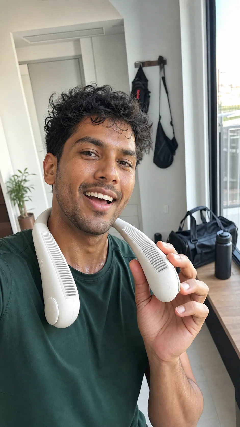 Creator reviewing a wearable neck fan after a workout